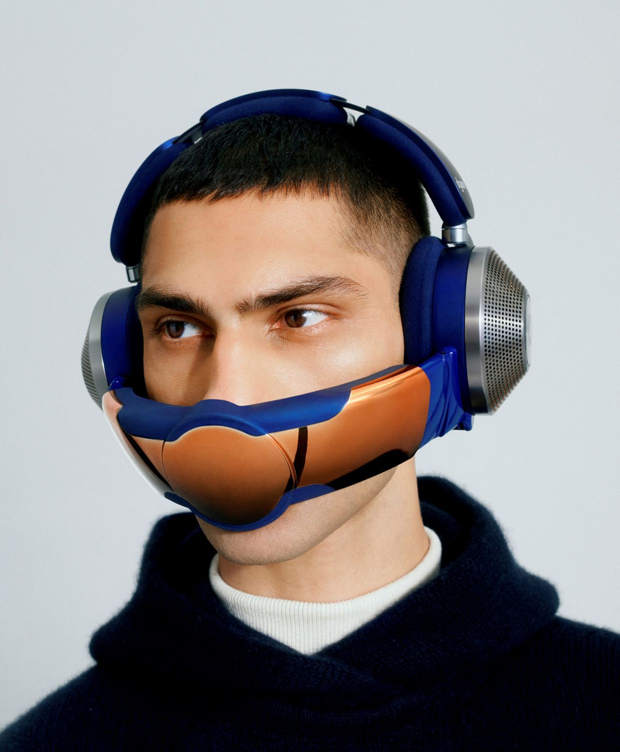 Man wearing Dyson Zone noise-cancelling headphones with visor